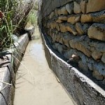 اجرای طرح بهسازی کانال ها برای جلوگیری از تلفات و هدر رفت آب در اراضی کشاورزی شهرستان لنده